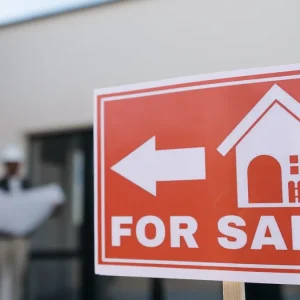 For sale sign in front of a house