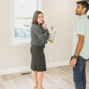 Two people doing a final house walkthrough with a clipboard